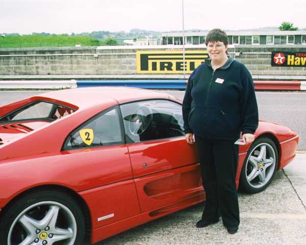 Caroline and the Ferrari 355 she drove at Thruxton
